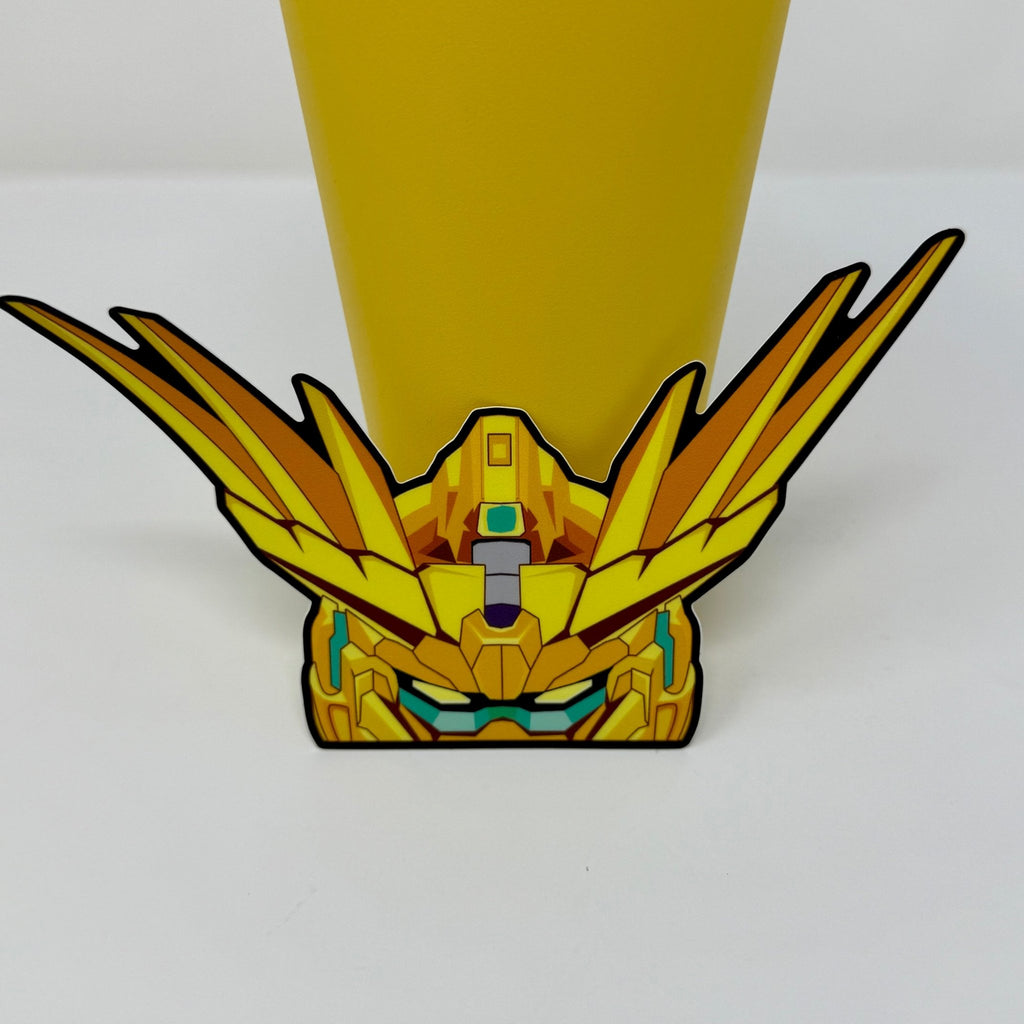 Waterproof vinyl Phenex Gundam sticker with gleaming gold armor and intricate details
